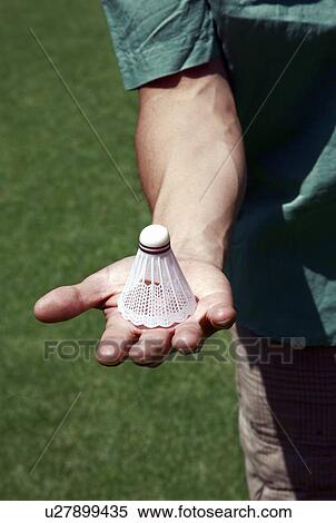 Stock Photography - Hand holding badminton ball. Fotosearch