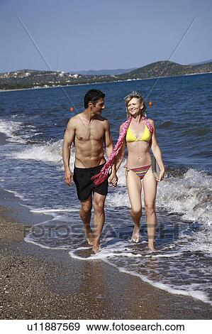 Mature adult couple on beach View Large Photo Image Stock Photo - Mature adult couple on beach. Fotosearch