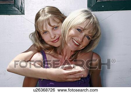 Stock Photograph - Mother and daughter posing. Fotosearch