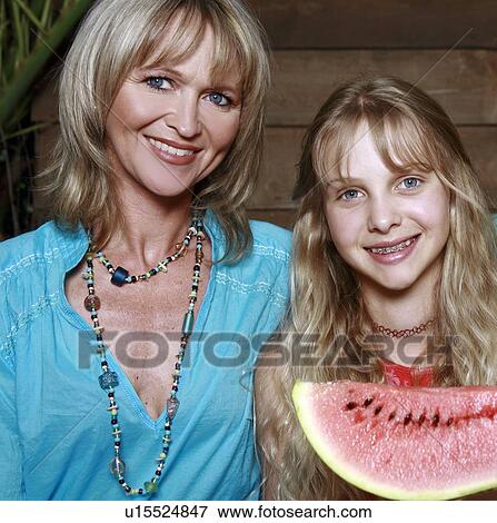 Stock Photo - Mother and daughter with watermelon. Fotosearch