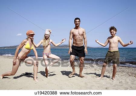 Parents with children on beach View Large Photo Image Stock Photo - Parents with children on beach. Fotosearch