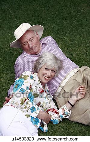 Stock Image - Senior couple in the park. Fotosearch