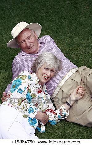 Stock Image - Senior couple in the park. Fotosearch