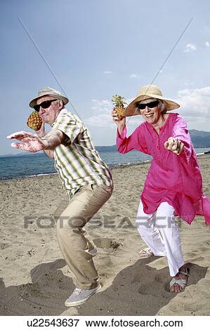 Senior couple with pineapples on the beach View Large Photo Image Stock Photo - Senior couple with pineapples on the beach. Fotosearch