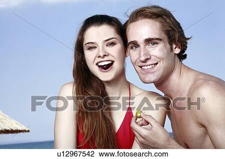 Young adult couple with olives View Large Photo Image Stock Image - Young adult couple with olives. Fotosearch