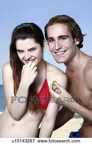 Young adult couple with olives View Large Photo Image Stock Photo - Young adult couple with olives. Fotosearch