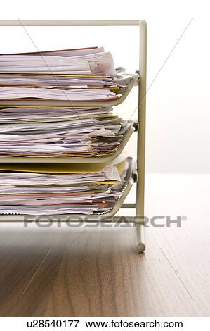 A Stack Of Paperwork Sitting In A Tray View Large Photo Image Stock Photo - A Stack Of Paperwork Sitting In A Tray. Fotosearch