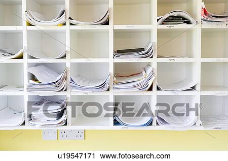 Stock Image - A Wall Of Cubbyholes In An Office. Fotosearch