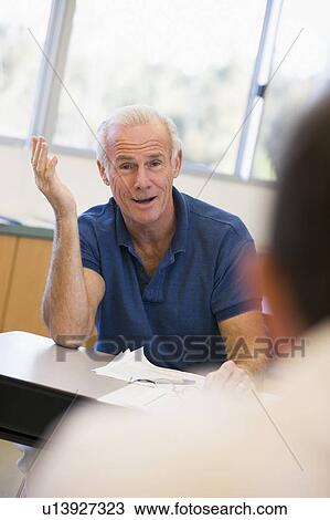 Adult student in class with teacher looking confused (selective focus) View Large Photo Image Stock Image - Adult student in class with teacher looking confused (selective focus). Fotosearch