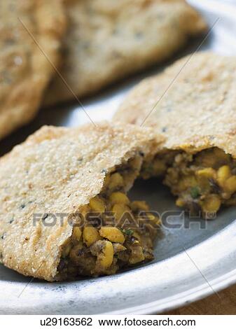 An opened Kachoris on a Pewter Plate View Large Photo Image Stock Image - An opened Kachoris on a Pewter Plate. Fotosearch