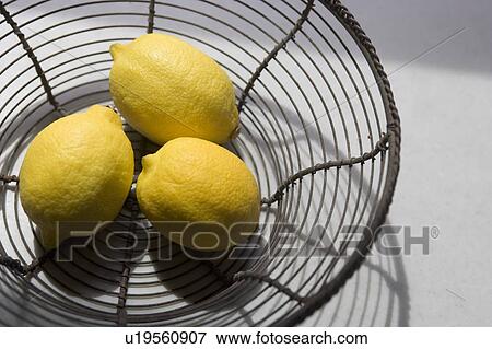 Basket of lemons View Large Photo Image Stock Photo - Basket of lemons. Fotosearch