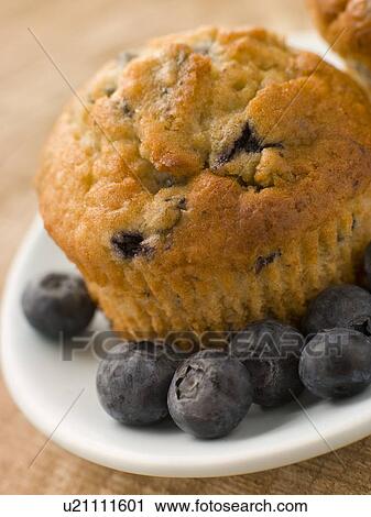 Blueberry Muffin On A Plate With Blueberries View Large Photo Image Stock Image - Blueberry Muffin On A Plate With Blueberries. Fotosearch