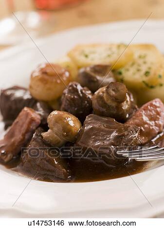 Boeuf Borguignon with Saute Potatoes View Large Photo Image Stock Photograph - Boeuf Borguignon with Saute Potatoes. Fotosearch