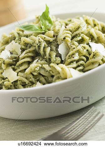 Bowl of Fusilli Pasta dressed in Pesto with Parmesan Shaves View Large Photo Image Picture - Bowl of Fusilli Pasta dressed in Pesto with Parmesan Shaves. Fotosearch