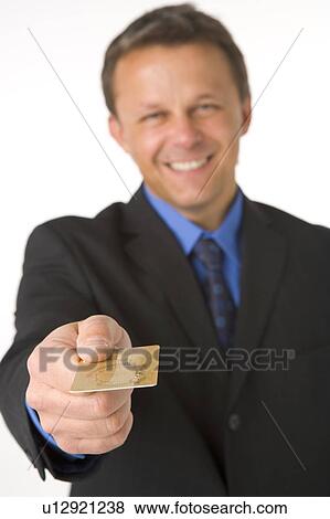 Businessman Handing Over Gold Credit Card View Large Photo Image Stock Photo - Businessman Handing Over Gold Credit Card . Fotosearch