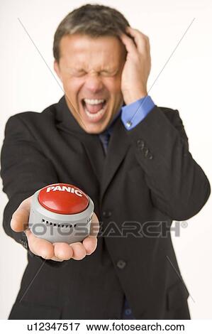 Businessman Holding A Panic Button View Large Photo Image Stock Photo - Businessman Holding A Panic Button . Fotosearch