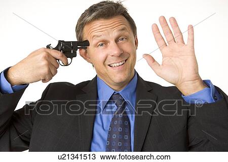 Businessman Holding Gun To His Head While Smiling And Waving View Large Photo Image Stock Image - Businessman Holding Gun To His Head While Smiling And Waving . Fotosearch