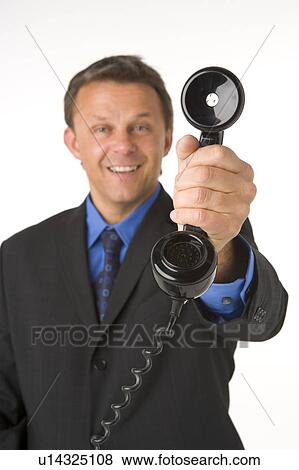Businessman Holding Telephone View Large Photo Image Stock Photo - Businessman Holding Telephone . Fotosearch