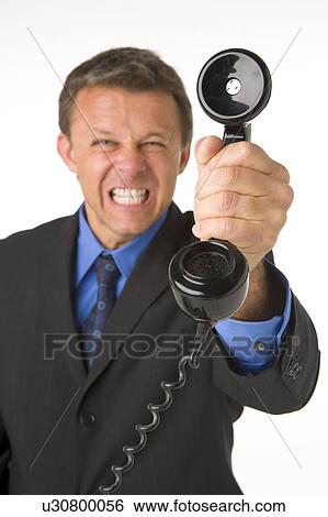 Stock Photograph - Businessman Holding Telephone . Fotosearch