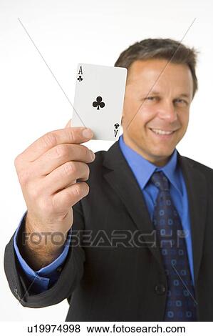 Stock Photo - Businessman Holding The Ace Of Clubs. Fotosearch