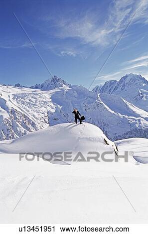 Businessman outdoors on snowy mountain using cellular phone View Large Photo Image Stock Image - Businessman outdoors on snowy mountain using cellular phone. Fotosearch