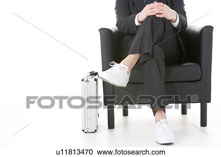 Businessman Sitting Wearing Sneakers View Large Photo Image Stock Image - Businessman Sitting Wearing Sneakers. Fotosearch