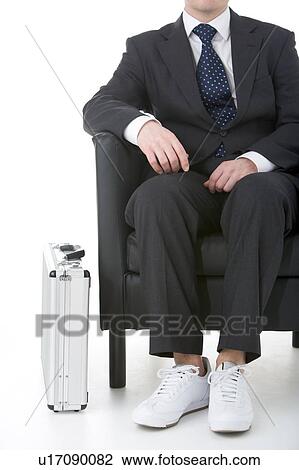 Businessman Sitting Wearing Sneakers View Large Photo Image Stock Image - Businessman Sitting Wearing Sneakers. Fotosearch