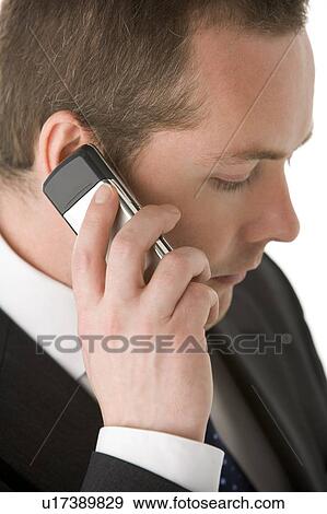 Stock Photo - Businessman Talking On Mobile Phone . Fotosearch