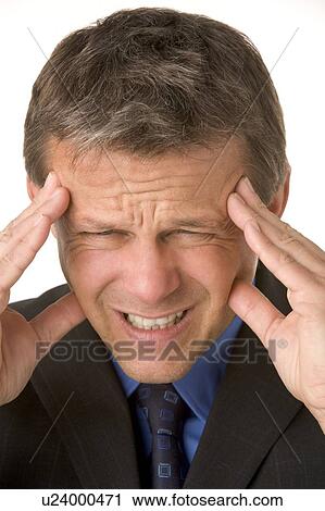 Stock Image - Businessman With Headache. Fotosearch
