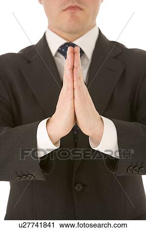 Stock Image - Businessman With His Hands Together. Fotosearch