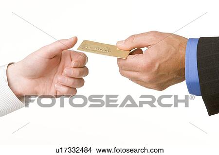 Businessmen Passing Another A Gold Credit Card View Large Photo Image Picture - Businessmen Passing Another A Gold Credit Card . Fotosearch