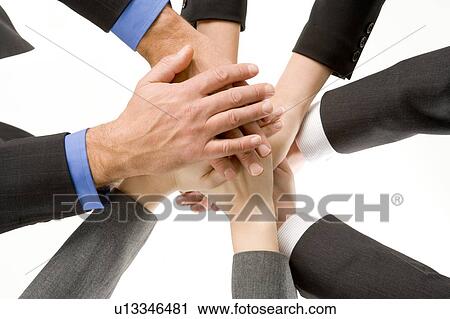 Stock Image - Businesspeople Hands In Together . Fotosearch