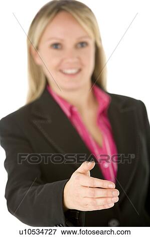 Stock Photo - Businesswoman Holding Her Hand Out Ready To Shake. Fotosearch