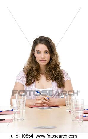 Businesswoman sitting in boardroom View Large Photo Image Picture - Businesswoman sitting in boardroom. Fotosearch