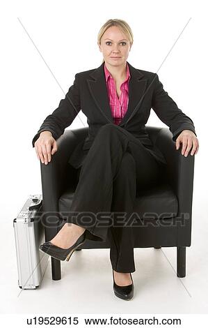 Stock Photography - Businesswoman Sitting In Leather Chair. Fotosearch