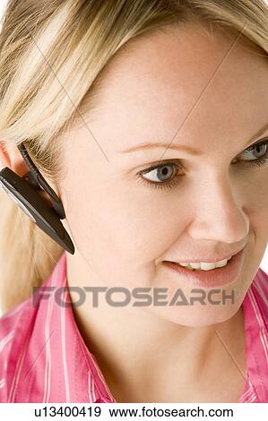 Stock Photo - Businesswoman Talking On Hands Free Phone . Fotosearch