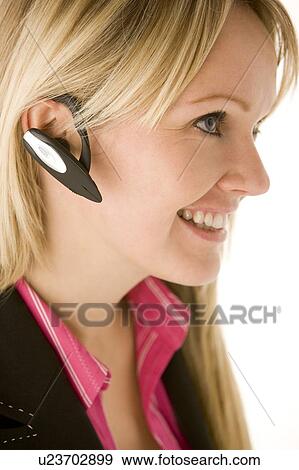Stock Photo - Businesswoman Talking On Hands Free Phone . Fotosearch