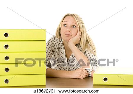 Stock Image - Businesswoman With Stack Of Folders. Fotosearch