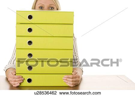 Stock Image - Businesswoman With Stack Of Folders. Fotosearch