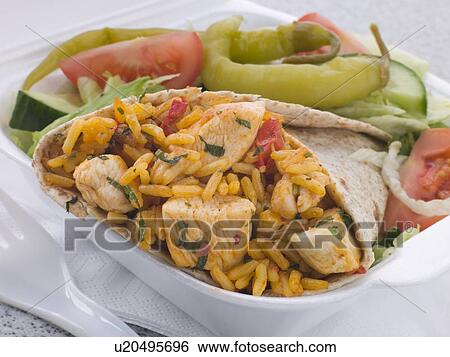 Stock Photograph - Chicken And Rice Burrito With Salad. Fotosearch