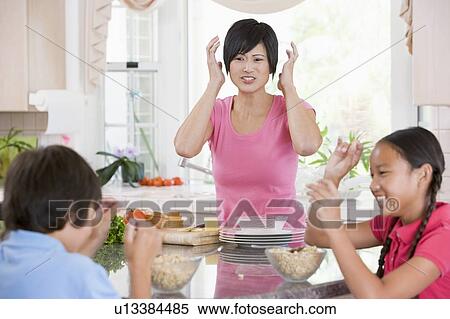 Stock Photography - Children Play Fight While Having Breakfast. Fotosearch