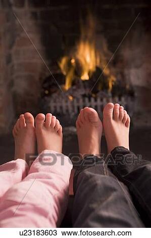 Children's feet warming at a fireplace View Large Photo Image Stock Image - Children's feet warming at a fireplace. Fotosearch