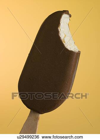 Stock Photograph - Close Up Of A Chocolate Coated Ice Block. Fotosearch