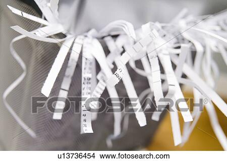 Picture - Close-Up Of An Overflowing Paper Shredder. Fotosearch