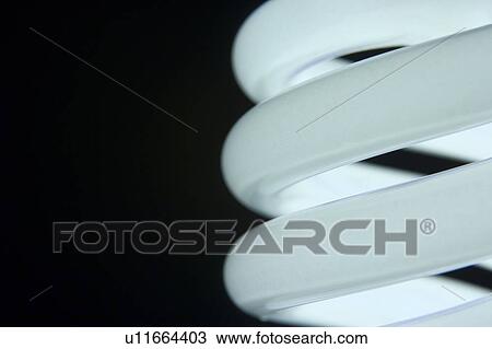 Stock Image - Close Up Of Energy Efficient Light Bulb. Fotosearch