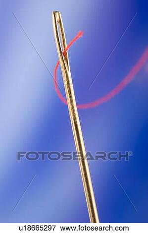 Stock Photo - Close Up Of Needle And Red Thread. Fotosearch