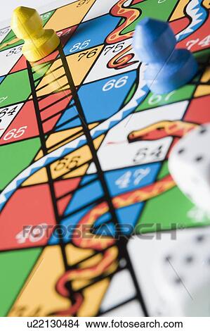 Picture - Close -Up Of Snakes And Ladders Board . Fotosearch