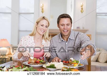 Picture - Couple Eating meal, mealtime Together . Fotosearch