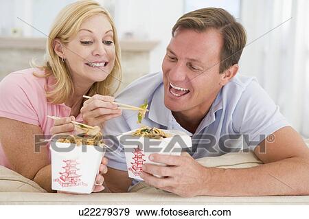 Couple Eating Takeaway meal, mealtime Together View Large Photo Image Stock Photo - Couple Eating Takeaway meal, mealtime Together. Fotosearch