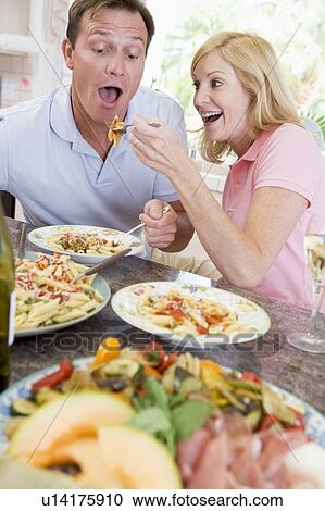 Couple Enjoying meal, mealtime Together View Large Photo Image Stock Image - Couple Enjoying meal, mealtime Together. Fotosearch